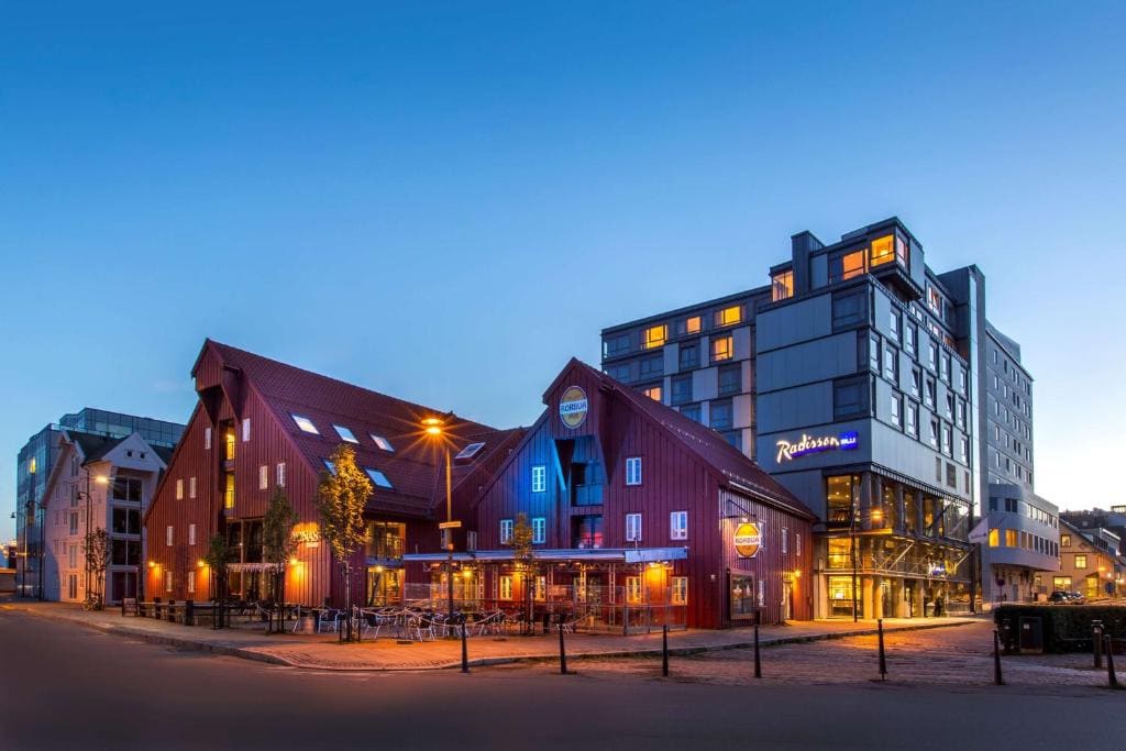 Hotels and historic waterfront buildings in Tromsø city centre at dusk