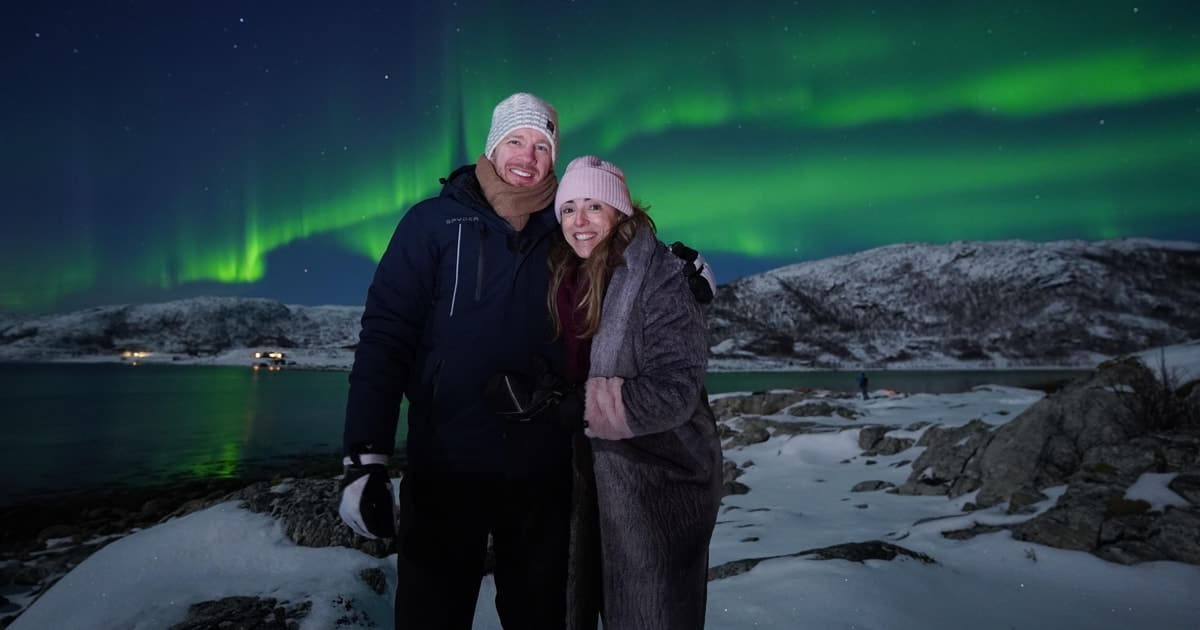 Travellers watching the northern lights near Tromsø
